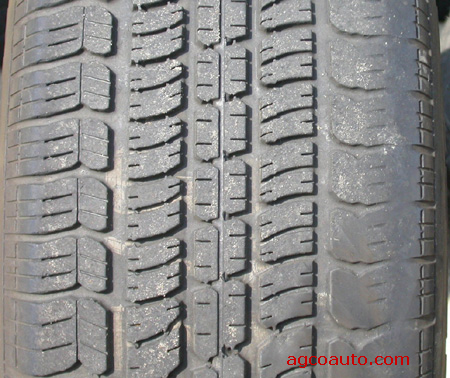 A tire showing wear from improper wheel alignment.